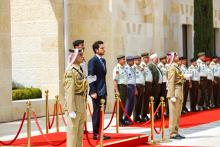 His Majesty the Supreme commander of Jordanian Armed Forces, Accompanied by Her Majesty Queen Rania Al Abdullah and HRH Crown Prince Al Hussein, hands the Hashemites flag the Chairman of the Joint Chiefs of Staff, Gen. Mashal Mohammad Zaben 9/6/2015