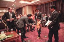 H.R.H. Crown Prince Al Hussein bin Abdullah II greets a young cochlear implant recipient during The Allgau-Orient Rallye closing ceremony, 23rd May 2014