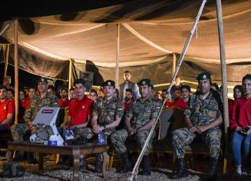 Crown Prince, accompanied by Haqiq initiative participants, attends night military drill